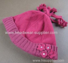 FLEECE HAT WITH KNITTED TURNUP AND FLOWER DECORATION