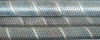 Spiral welded perforated pipe with various perforation patterns