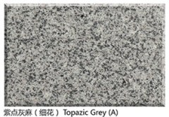 Polished topazic imperial granite