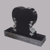 Granite headstones with flowers and birds engraving