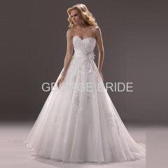 GEORGE BRIDE strapless Organza ballgown with asymmetrical wrap and sash detail