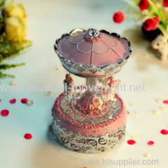 PINK POLYRESIN MUSICAL CAROUSEL