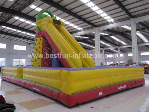 Inflatable slide climbing rock wall