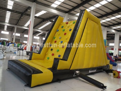 Inflatable tower climbing wall with slide