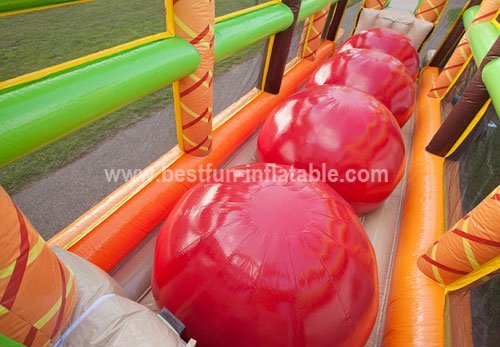 Inflatable wipe out ball obstacle course