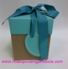 square gift boxes with green ribbon