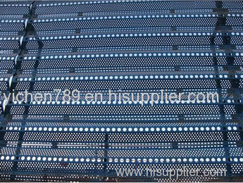 Windbreak and dust wall - perforated corrugated panel barrier