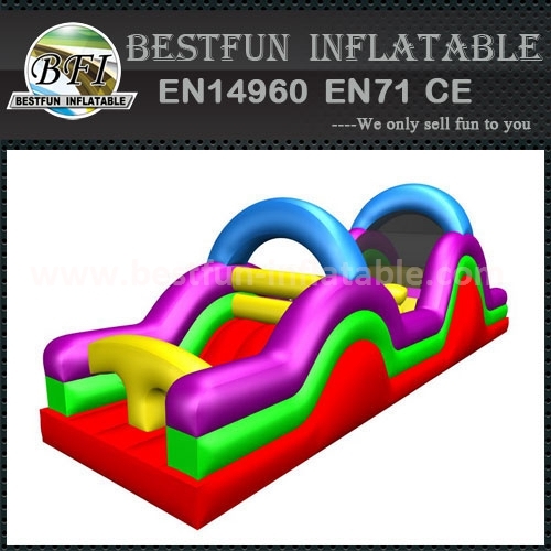 Inflatable obstacle course with slide and tunnel