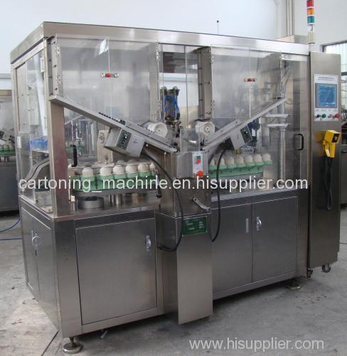 Soft tube filling and sealing machine