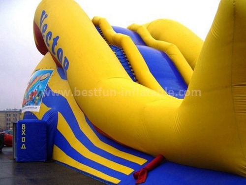Inflatable climbing wall with slide