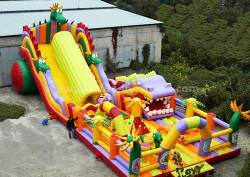 Inflatable obstacle course slide