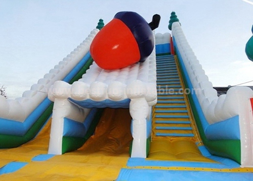 Inflatable trampoline with slide