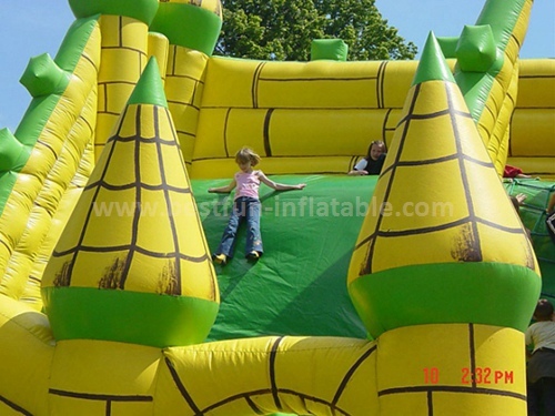 Large inflatable green slide