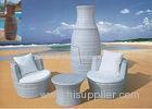 White Stackable Rattan Furniture Coffee Table And Chair Stacked Into Flower Pot