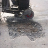 how to repair a concrete driveway with large potholes