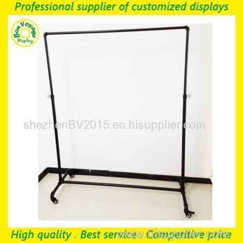 Floor standing adjustable metal rolling pipe clothes display rack