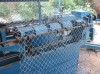 Semi-automatic chain link weaving machine