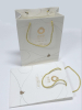 Custom designed gold stamping craft paper packaging bag with white cotton rope