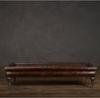 Dark brown leather ottoman footstool Covered in leather with Turned oak legs