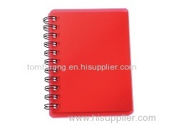 Red spiral pocket notebook with sticky notes