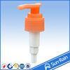 Orange plastic lotion pump for shampoo bottle