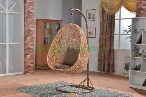 Yellow color rattan hammock with grey cushions