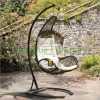 Black rattan hammock with white color cushions