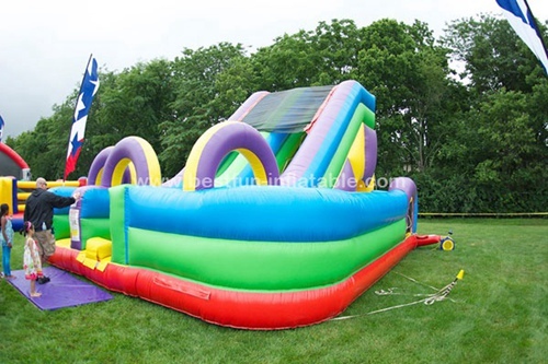 Inflatable jumping bouncer house with slide