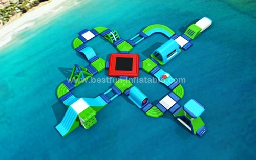 Inflatable floating water park with obstacles