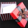 Red Square Cardboard Box The Ribbon And White Pillow