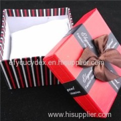 Red Square Cardboard Box The Ribbon And White Pillow