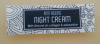 anti ageing night cream bottle labels with flower pattern background