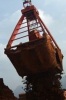 Mechanical nickel ore grab for sticky materials