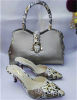 Silver high heel pointed toe shoes with matching handbag