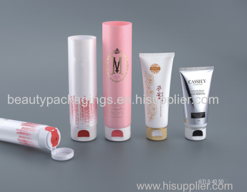 Cosmetic packaging tubes with automatic pop-up caps