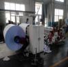 Biaxial center surface slitting and rewinding machine