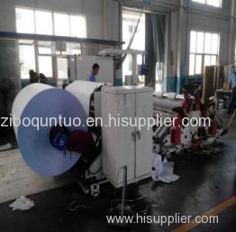 Biaxial center surface slitting and rewinding machine