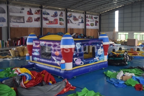 Commercial inflatable bounce house with rocket theme