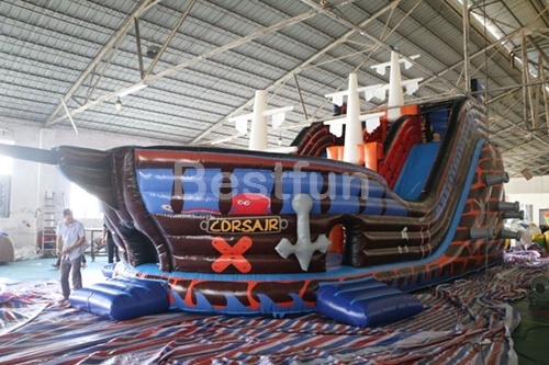 Inflatable pirate ship with slide inside