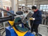 Automatic circumferential seam welding machine for filters.