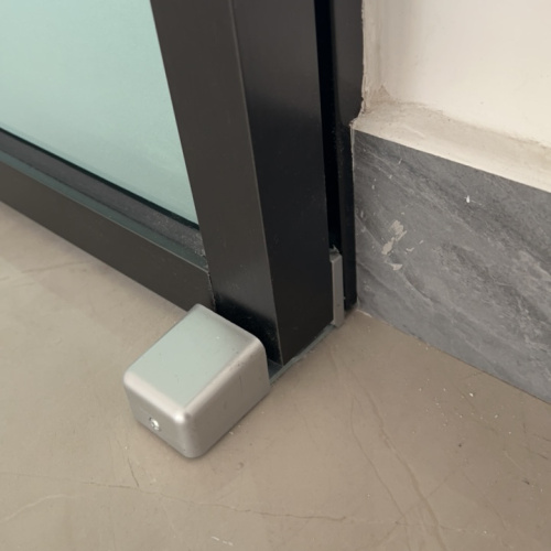 automatic door floor guide for framed doors