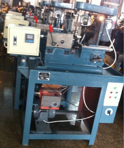 Machine for hole making on hollow brass pins
