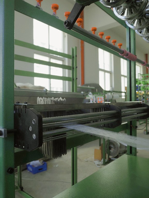 Needle weaving area for narrow elastic tape