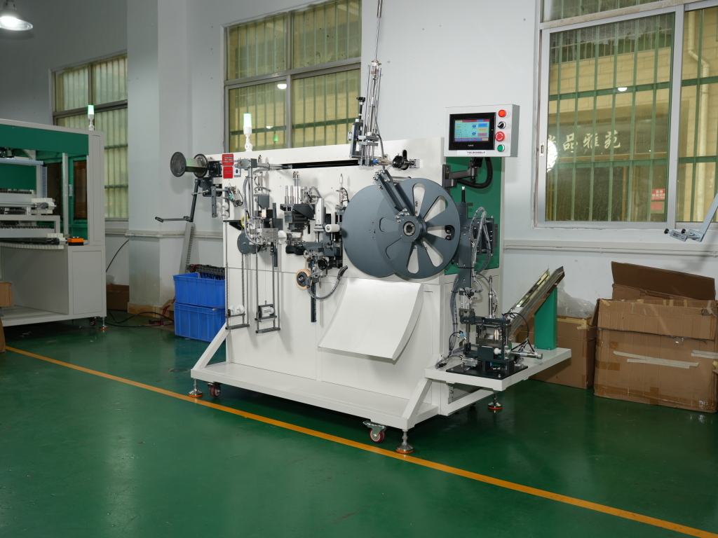 Automatic webbing winding machine guide and tension section